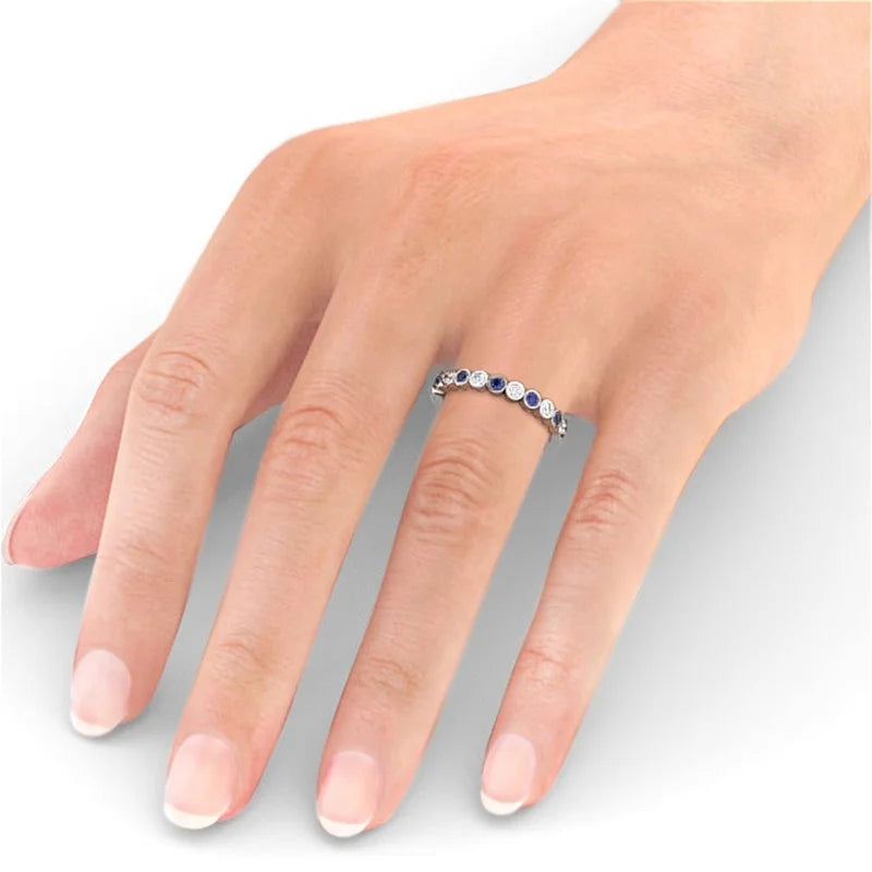 14K White Gold Blue Sapphire Eternity Band Y33517